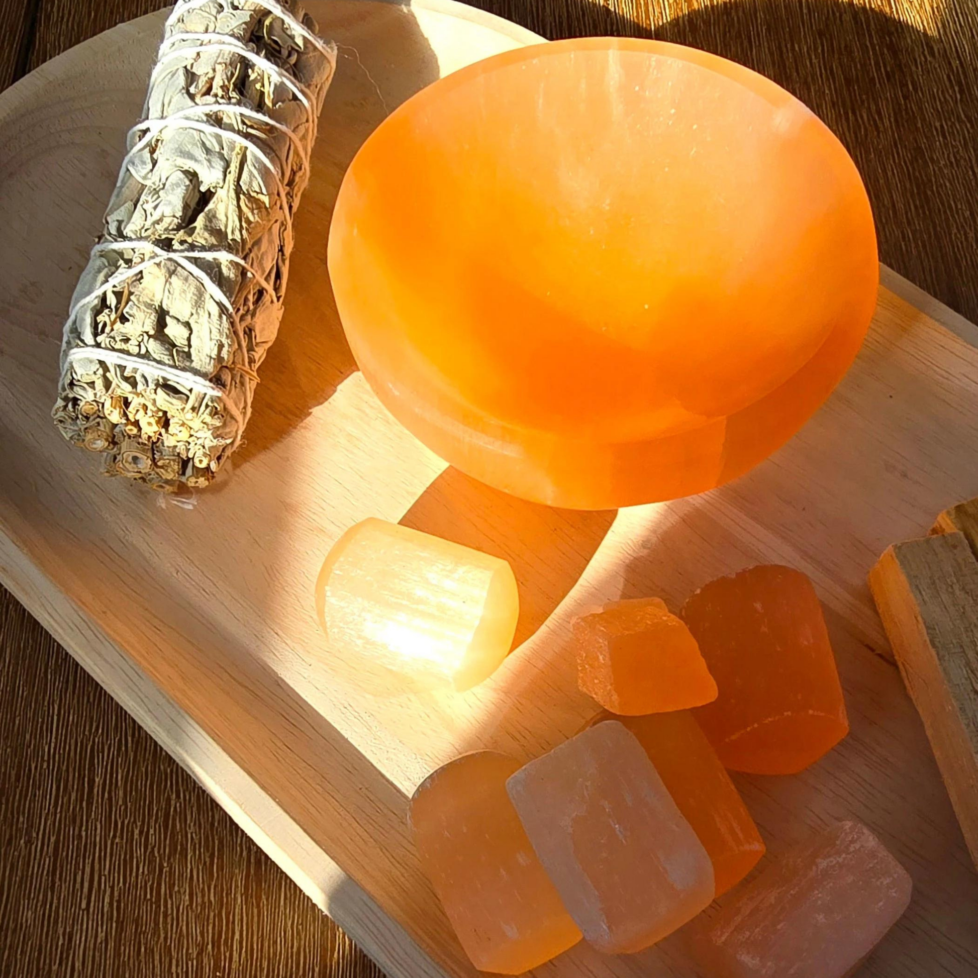 This beautifully carved trinket bowl, handcrafted from natural peach selenite, is not only a stunning decorative piece but also a powerful tool for energy cleansing and promoting positive vibrations.  Dimensions: